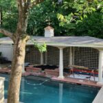 a cupola on a pavilion located beside a swimming pool