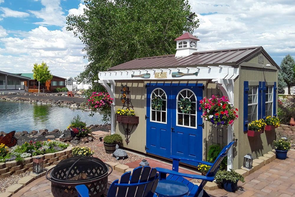 small shed by the water with metal roof cupola